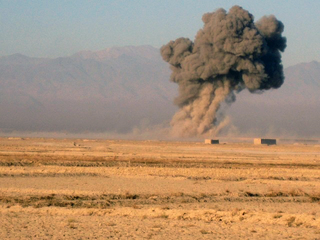 Soldiers from Company A, 3rd Battalion, 187th Infantry Regiment watch from an observation post as air assets are dropped on insurgent positions during Operation Iron Blade II Nov. 28th. Three infantry companies from 3rd Bn. 187th Inf. Regt., along with Afghan National Security Forces units conducted the operation to deny enemy safe havens in Ghazni Province. (Photo by U.S. Army Lt. Col. David Fivecoat, 3rd Battalion, 187th Infantry)