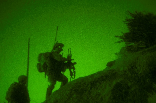 Scaling treacherous terrain in the dead of night, Afghan National Army soldiers and troops assigned to Company B, 1st Battalion, 327th Infantry Regiment, Task Force Bulldog, use the cover of night to move into suspicious villages on a mountainside in the Pech River Valley in eastern Afghanistan’s Kunar Province Nov. 23rd. (Photo by U.S. Army Staff Sgt. Mark Burrell, Task Force Bastogne Public Affairs)