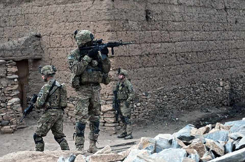 A Jamaican native, U.S. Army Staff Sgt. McCarthy Phillip (center), an infantry squad leader who resides in Decatur, GA, assigned to Company C, 1st Battalion, 327th Infantry Regiment, Task Force Bulldog, and other Soldiers patrol in a small village in the Pech River Valley in eastern Afghanistan's Kunar Province Nov. 20th. (Photo by U.S. Army Staff Sgt. Mark Burrell, Task Force Bastogne Public Affairs Office)