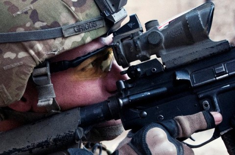 Taking a look through his scope, U.S. Army Staff Sgt. Kimo L. Griggs, an infantry squad leader from Maui, Hawaii, assigned to Company C, 1st Battalion, 327th Infantry Regiment (Task Force Bulldog), 101st Airborne Division, scans the Pech River Valley for insurgent movement in eastern Afghanistan's Kunar Province Nov. 20th. (Photo by U.S. Army Staff Sgt. Mark Burrell, Task Force Bastogne Public Affairs)