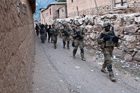 At the end of their patrol, U.S. Army Staff Sgt. McCarthy Phillip (front), an infantry squad leader from Company C, 1st Battalion, 327th Infantry Regiment (Task Force Bulldog), 101st Airborne Division, leads the troops out of the small village in the Pech River Valley in eastern Afghanistan's Kunar Province Nov. 20th. (Photo by U.S. Army Staff Sgt. Mark Burrell, Task Force Bastogne Public Affairs)