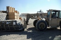 U.S. Army Cpl. Sean C. Bruce, a motor transportation specialist with Company A, 801st Brigade Support Battalion, 4th Brigade Combat Team, 101st Airborne Division and native of Salina, KS, picks up a pallet of supplies with a forklift destined for a convoy logistic patrol Nov. 6th. CLPs allow the Currahees to move large amounts of supplies throughout Paktika Province. (Photo by U.S. Army Staff Sgt. Todd A. Christopherson, Task Force Currahee Public Affairs)