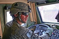 U.S. Army Spc. Garrett Bartlett, maneuvers his light medium tactical vehicle trailer through the supply yard Nov. 17th at Forward Operating Base Fenty. Bartlett, a native of McQueeney, Texas, has driven more than 11,000 miles of convoy routes since arriving in country three months ago. (Photo by U.S. Army Staff Sgt. Ryan C. Matson, Task Force Bastogne Public Affairs)