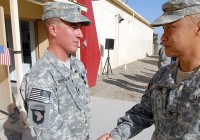 U.S. Army Spc. Nicholas Robinson from Tacoma, Wash., Company D, 1st Battalion, 187th Infantry Regiment, 3rd Brigade Combat Team, 101st Airborne Division, shakes hands with U.S. Army Col. Viet Luong, 3rd BCT commander from Fort Campbell, KY, following a Dec. 23rd award ceremony at Forward Operating Base Salerno in which Robinson received the Silver Star Medal. (Photo by U.S. Army Pfc. Christopher McKenna, Task Force Rakkasan Public Affairs)