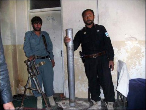 Andar District’s police chief inspects a cache find consisting of an 82mm mortar system and ammunition found in Chor Village, Andar District Dec. 7th by members of Company C, 3rd Battalion, 187th Infantry Regiment. (Photo by U.S. Army 1st Lt. R.J. Peek, Task Force Iron Rakkasan Information Operations)