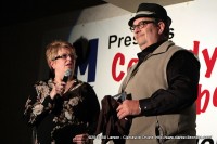 Denise Skidmore from Project F.U.E.L. presenting Hank Bonecutter with a plaque in appreciation of his service to the community.