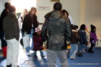 Children stream into the First Baptist Church Gym for the Kiwanis Club Children’s Christmas Party