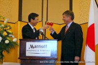 Consul-General Hiroshi Sato with Commissioner Matthew H. Kisber  toasting the Emperor of Japan