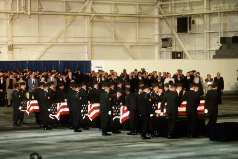 Mourners looks on as members of the 101st Airborne Division carry a casket containing the remains of members of the 3rd Bn., 502nd Inf., 101st Airborne Div., into a hangar for a memorial service. On December 12, 1985, 248 soldiers of the 3rd Battalion were killed in a plane crash at the Gander Airport, Newfoundland, Canada. They were returning to the United States after participating in peacekeeping duty with the Multi-national Force and Observers in the Sinai Desert. Mourners looks on as members of the 101st Airborne Division carry a casket containing the remains of members of the 3rd Bn., 502nd Inf., 101st Airborne Div., into a hangar for a memorial service. On December 12, 1985, 248 soldiers of the 3rd Battalion were killed in a plane crash at the Gander Airport, Newfoundland, Canada. They were returning to the United States after participating in peacekeeping duty with the Multi-national Force and Observers in the Sinai Desert.