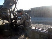 Cannon crewmember, U.S. Army Pfc. Raymond Cecil, Battery A, 2nd Battalion, 320th Field Artillery Regiment, raises the elevation on the howitzer Dec. 12th at Forward Operating Base Kalagush. Cecil, a Nashville, TN, native, is currently deployed in eastern Afghanistan’s Nuristan Province. He is scheduled to redeploy back to Fort Campbell, KY, with his unit in the spring. (Photo by U.S. Army Sgt. Bill Murray, 1st Brigade Combat Team, 101st Airborne Division)