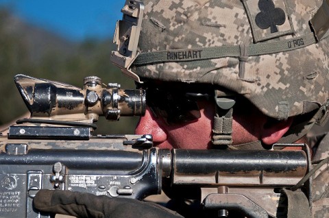 U.S. Army 1st Lt. Andrew D. Rinehart, an infantry platoon leader from Belmont, NC, assigned to Bayonet Company, 2nd Battalion, 327th Infantry Regiment, Task Force No Slack, uses his scope to look for insurgent activity on a mountainside overlooking the Ganjgal Valley in eastern Afghanistan’s Kunar Province Dec. 11th. (Photo by U.S. Army Staff Sgt. Mark Burrell, Task Force Bastogne Public Affairs)