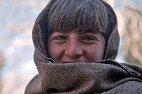 An Afghan boy smiles after being seen by doctors during a free clinic at the Mannakhil Comprehensive Health Care Center in Sherzad District in eastern Afghanistan’s Nangarhar Province Dec. 26th. (Photo by U.S. Army Staff Sgt. Mark Burrell, Task Force Bastogne Public Affairs)