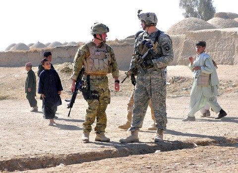 Flying Officer Stephen Milne, 51 Squadron Royal Air Force Regiment, officer commanding C flight (left) and Staff Sgt. Daniel Damschen, Task Force Saber Pathfinder squad leader (right) conduct a friendly patrol together during a key leader engagement mission in Kandahar province, Afghanistan, Nov. 16th. (Photo by Sgt. 1st Class Sadie Bleistein)