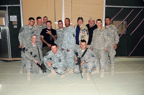 Soldiers from Task Force Currahee pose for a photo with actor Robin Williams, country music singer Kix Brooks and country music songwriter Bob Dipiero at Forward Operating Base Sharana Dec. 15th. (Photo by U.S. Army Spc. Christina Sinders, Task Force Currahee Public Affairs)