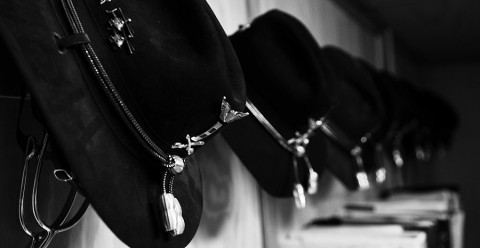 OH-58D Kiowa Warrior helicopter Cavalry pilots hang their Stetsons and spurs on the wall throughout their deployment to Afghanistan. (Photo by Spc. Tracy Weeden)