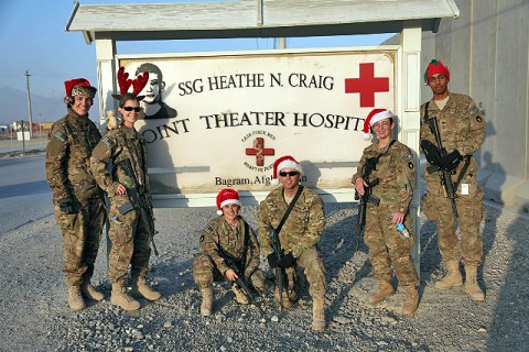 U.S. Army Capt. Martha Kester (far left), U.S. Army 1st Lt. Sarah Droll (left), U.S. Army Staff Sgt. Jackie Malloy (center), U.S Army Sgt. Jarrod Hogan (center), U.S. Army 1st Lt. Cecelia Anderson (right), and U.S. Army Sgt. Harold Dudley (far right), all with 334th Brigade Support Battalion, Task Force Archer, pose in front of the Staff Sgt. Heathe N. Craig Joint Theater Hospital.(Photo by U.S. Army Spc. Kristina L. Gupton, Task Force Red Bulls Public Affairs)