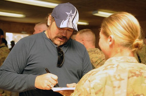 Country Music singer Buddy Jewell of Nashville, Tennessee, signs autographs for Soldiers of 94th Brigade Support Battalion’s Task Force Strength, 4th Brigade Combat Team, 10th Mountain Division, during a USO visit to Forward Operating Base Shank Dec. 21st. (Photo by U.S. Army Spc. Brian P. Glass, Task Force Patriot Public Affairs)