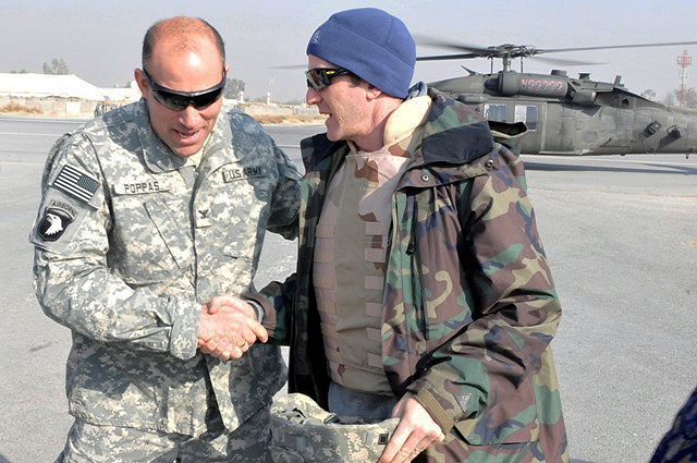 U.S. Army Col. Andrew P. Poppas of Janesville, WI, Task Force Bastogne commander, greets Lance Armstrong upon arrival to Forward Operating Base Fenty in eastern Afghanistan’s Nangarhar Province Dec. 15th. (Photo by U.S. Army Spc. Richard Daniels Jr., Task Force Bastogne Public Affairs)