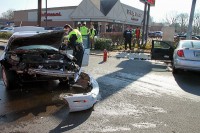 Officer Leo Kryszewski getting vehicle info from damaged Saturn ION.