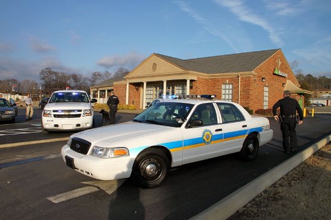 Police units at the scene of the robbery.