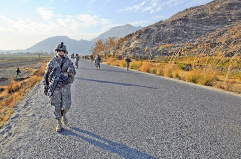 U.S. Army Spc. Cristine Gallagher of Victorville, CA, machine-launched grenade gunner for the 64th Military Police Company based at Combat Outpost Fortress, conducts a foot patrol through Noor Gal District Jan. 3rd. (U.S. Army photo by U.S. Air Force Capt. Peter Shinn/RELEASED)