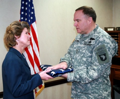 Maj. Gen. Frank Wiercinski, right, presents an American flag that flew over 101st Airborne headquarters in Afghanistan to Clarksville Mayor Kim McMillan.