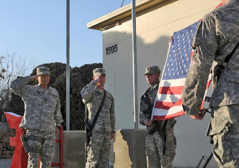 U.S. Army Col. Viet Luong and U.S. Command Sgt. Maj. Gregory Patton, commander and command sergeant major of the 3rd Brigade Combat Team, 101st Airborne Division based out of Fort Campbell, KY, salute the World Trade Center flag at Forward Operating Base Salerno Jan. 24th. (U.S. Army photo by Spc. Tobey White, Task Force Duke Public Affairs)