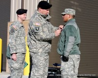 Major General Francis “Frank” Wiercinski the Senior Commander for Fort Campbell pins the Purple Heart on Specialist Leandro Daniel Garcia III