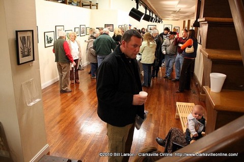 A standing room only crowd at the Friends of Photography Exhibit at the Downtown Artists Co-Op