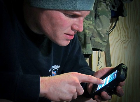 U.S. Army Capt. Jonathan J. Springer, 101st Airborne Division, checks the new smart phone application he invented while stationed in eastern Afghanistan’s Pech River Valley Jan. 9th. Springer invented the navigational application with servicemembers in mind and said it will be available on the open market in February. (Photo by U.S. Army Sgt. 1st Class Paul Shoemaker, 3rd Battalion, 321st Field Artillery Regiment)