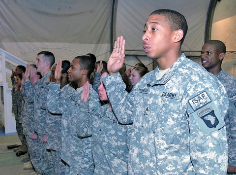 Pledging to serve as a leader, U.S. Army Sgt. Michael McReynolds of Chattanooga, TN, with Company C, Headquarters and Headquarters Battalion, 101st Airborne Division, is inducted into the noncommissioned officer corps during a ceremony at Bagram Airfield Jan. 21st. McReynolds is a cable systems installer-maintainer at Forward Operating Base Salerno. (Photo by U.S. Army Spc. Adam L. Mathis, 17th Public Affairs Detachment)