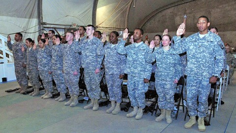 A group of noncommissioned officers take a pledge during an NCO induction ceremony at Bagram Airfield Jan. 21st. (Photo by U.S. Army Spc. Adam L. Mathis, 17th Public Affairs Detachment)