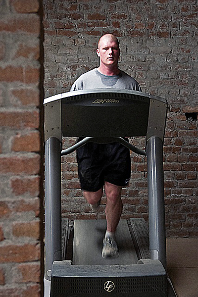 U.S. Army Pfc. Gregory K. Martin, a fire control direction specialist from Pleasant Grove, AL,Task Force Panther, runs in Forward Operating Base Connolly’s gym in eastern Afghanistan’s Nangarhar Province Dec. 22nd. Martin has lost more than 30 pounds this deployment. (Photo by U.S. Army Staff Sgt. Mark Burrell, Task Force Bastogne Public Affairs)