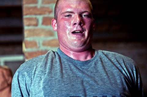 Straining to get one more shoulder dip during physical training, U.S. Army Pfc. Gregory K. Martin, Task Force Panther, works out at Forward Operating Base Connolly’s gym in eastern Afghanistan’s Nangarhar Province Dec. 22nd. (Photo by U.S. Army Staff Sgt. Mark Burrell, Task Force Bastogne Public Affairs)