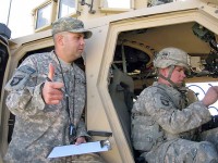 U.S. Army Sgt. 1st Class Jorge Vera from Los Angeles, Battalion Fires noncommissioned officer, gives the sign of approval for U.S. Army Spc. Jason Dunlap from Eugene, OR, with Company C, during one of the Task Force Iron Soldier of the Year competition events. (Photo by U.S. Army 1st Lt R.J. Peek, Task Force Rakkasan)