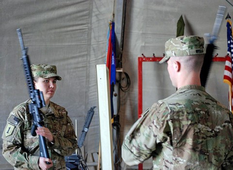 U.S. Army Pfc. Lauren Sivak, an intelligence analyst from Cleveland, Ohio, and U.S. Army Spc. Brandon Wells, a topographic analyst from Hartsville, S.C., both of Headquarters, Headquarters Company, 3rd Brigade Combat Team, 1st Infantry Division, practice before participating in the color guard of the transfer of authority ceremony held at Forward Operating Base Salerno in Khowst Province Jan. 30th. (Photo by U.S. Army Staff Sgt. Ben K. Navratil, Task Force Duke Public Affairs)