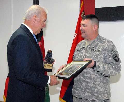 U.S. Army Brig. Gen. Warren Phipps, deputy commanding general for support for Combined Joint Task Force-101 and Regional Command - East, presents Vice President Joe Biden with gifts before he departs Bagram Airfield Jan. 12th. Biden joined about 400 servicemembers for breakfast and thanked each of them individually during his visit. (Photo by U.S. Army Sgt. David House, 17th Public Affairs Detachment)