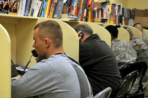 Soldiers call family and friends at the United Service Organizations on Forward Operating Base Fenty in eastern Afghanistan’s Nangarhar Province Jan. 24th. The nearly all-volunteer staff keeps the facility running, allowing it to stay open longer so Soldiers have a place to come and relax and unwind after missions. (Photo by U.S. Army Spc. Richard Daniels Jr., Task Force Bastogne Public Affairs)