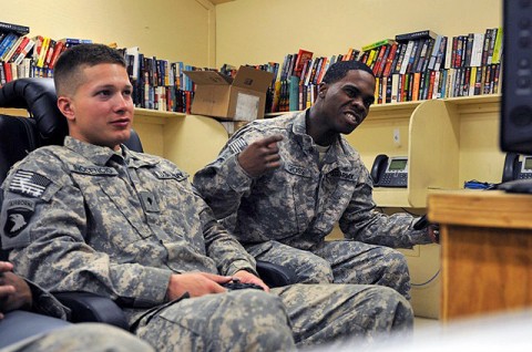 U.S. Army Spc. Andres Inocencio (left), a gunner, and U.S. Army Spc. Quentin Gross, a driver, both with the Fire Support Cell, 2nd Battalion, 327th Infantry Regiment, 1st Brigade Combat Team, 101st Airborne Division, play a video game at the United Service Organizations on Forward Operating Base Fenty in eastern Afghanistan’s Nangarhar Province Jan. 24th. (Photo by U.S. Army Spc. Richard Daniels Jr., Task Force Bastogne Public Affairs)