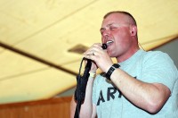 U.S. Army Pfc. James Keefer, a mechanic with Headquarters, Headquarters Battery, 1st Battalion, 6th Field Artillery, 3rd Brigade Combat Team, 1st Infantry Division, Task Force Duke, sings with the 101st Airborne Division rock band at a practice before their performance at Forward Operating Base Salerno Feb. 20th. (Photo by U.S. Army Staff Sgt. Ben K. Navratil, Task Force Duke Public Affairs)