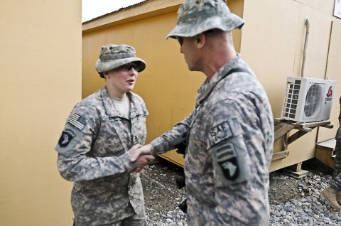 U.S. Army Staff Sgt. Mary E. Crawford, a Bellingham, WA, native, an armament noncommissioned officer in charge assigned to Company B, 426th Brigade Support Battalion, 1st Brigade Combat Team, 101st Airborne Division, proudly shakes hands with Command Sgt. Maj. Scott Schroeder, the 101st Airborne Division’s senior enlisted Soldier, Feb. 16th. (Photo by U.S. Army Spc. Richard Daniels Jr., Task Force Bastogne Public Affairs)