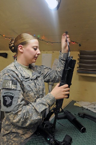 U.S. Army Staff Sgt. Mary Crawford, repairs a rifle Feb. 18th. Crawford was promoted to staff sergeant in a battlefield promotion at Forward Operating Base Fenty Feb. 16th. (Photo by U.S. Army Spc. Richard Daniels Jr., Task Force Bastogne Public Affairs)