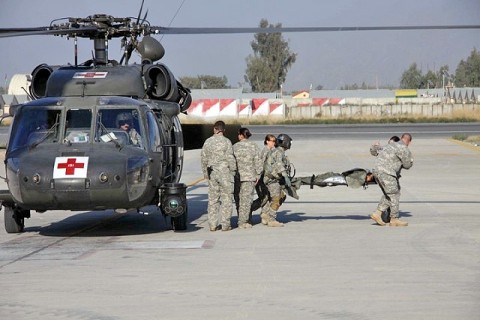 Soldiers in Company C DUSTOFF, Task Force Phoenix, 10th Combat Aviation Brigade, TF Falcon, remove a patient from a UH-60 Blackhawk medevac helicopter at Jalalabad Airfield February 3rd. (Photo by U.S. Army Capt. Andrew Wilson, Company C DUSTOFF)