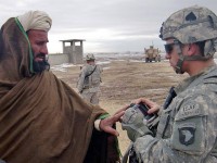 U.S. Army Pfc. Jason Conner, an infantryman with 3rd Squad, 3rd Platoon, Company C, 1st Battalion, 506th Infantry Regiment, 4th Brigade Combat Team, 101st Airborne Division, and native of Boise, Idaho, enters data related to a local villager into the Hand-Held Interagency Identity Detection Equipment during the squad’s visit to Jani Khel, Afghanistan, Feb. 10th. (Photo by Kurt Muncy, Task Force Currahee)