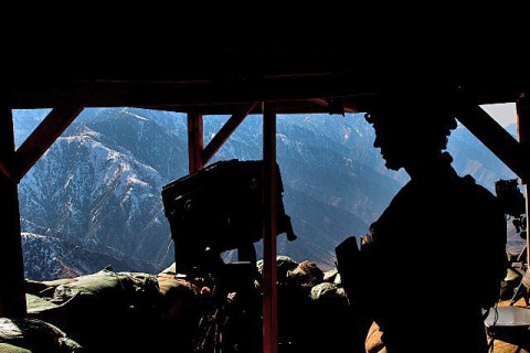 From a remote observation post high up in the Hindu Kush Mountains on the border of Pakistan, U.S. Army Sgt. Matthew B. Sorrell stands guard overlooking “Rocket Ridge” at Observation Post Mustang in eastern Afghanistan’s Kunar Province Jan. 25th. The Soldiers named the ridge Rocket Ridge because the Taliban use it to fire rockets at them before they suppressed the area. (Photo by U.S. Army Staff Sgt. Mark Burrell, Task Force Bastogne Public Affairs)