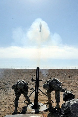 U.S. Army Pfc. Anthony Thompson, a mortarman with Mortar Platoon, 101st Airborne Div. and Pvt. Taylor Hocking, a mortarman with Mortar Plt., 101st Airborne Div. fire 120mm mortar rounds during an ANA forward observer live-fire training event Jan. 31st, 2011. (U.S. Army photo by Sgt. Luther L. Boothe Jr., Task Force Currahee Public Affairs)