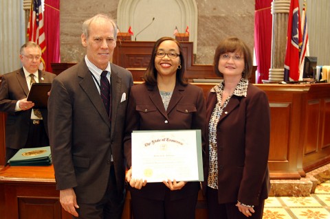 Comptroller of the Treasury Justin Wilson, left, and UT Vice President of Public Service Mary Jinks, present a Certified Municipal Finance Officers certificate to City of Clarksville Senior Accountant Deborah K. Johnson.