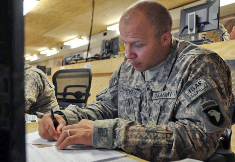 U.S. Army Sgt. Tyrone J. Harvey of St. Louis, a brigade aviations operations noncommissioned officer assigned to Headquarters and Headquarters Company, 4th Brigade Combat Team, 101st Airborne Division, completes paperwork at Forward Operating Sharana Feb. 21st. Harvey was recently notified that he is a preliminary match to donate bone marrow. (Photo by U.S. Army Spc. Kimberly K. Menzies, Task Force Currahee Public Affairs)