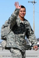 Capt. San Gil waves to his family as he walks towards the hanger