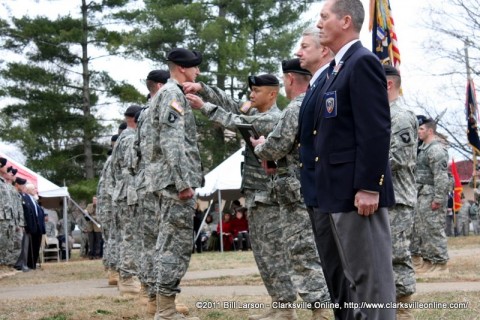 3rd BCT Commander Col. Viet Luong pins the Distinguished Member of the Regiment pin to one of the recipients